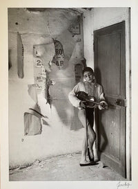 Le violoniste aux affiches, Arles by Lucien Clergue, 1955